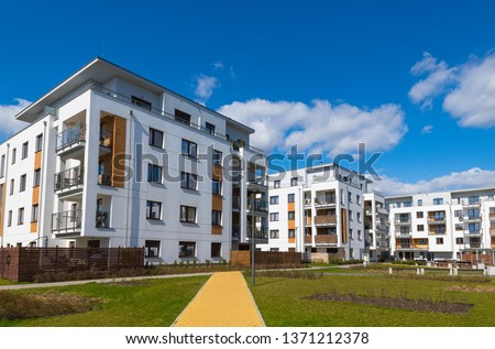 New housing estate buildings apartments in town. Royalty-Free Stock Photo #1371212378