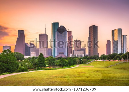Houston, Texas, USA downtown city skyline and park at dawn.