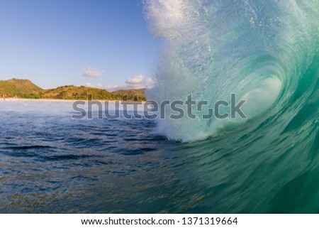 huge wave crashing in indonesia