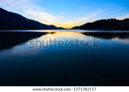 Beautiful sunrise on the lake Fuschl.  Austrian Alps, Salzburg region. 