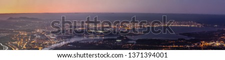 Night view of long panoramic exposure of Santander city at sunset, large format photography.