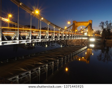 long exposure stone bridge by night in Wroclaw