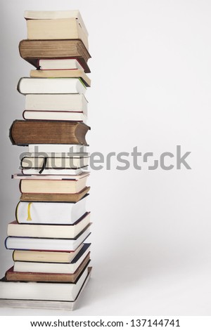 A pile of traditional colorful books, different sizes, big and small, thin and thick books