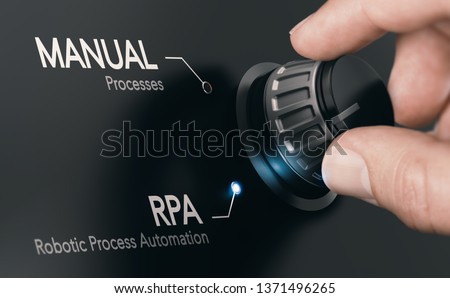 Hand turning a knob over dark grey background and selecting RPA (Robotic Process Automation) mode. Artificial Intelligence concept. Composite image between a hand photography and a 3D background. Royalty-Free Stock Photo #1371496265