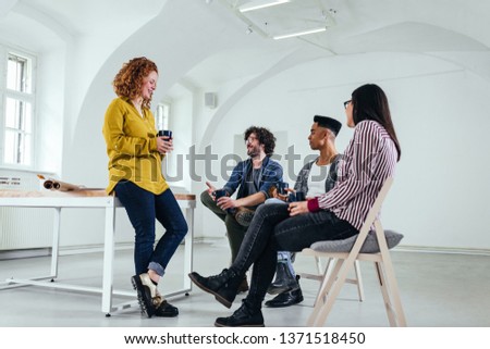 Architects having a discussion in their office