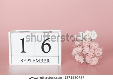September 16th. Day 16 of month. Calendar cube on modern pink background, concept of bussines and an importent event.