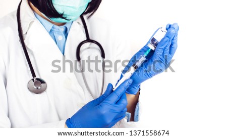 Female doctor in white lab coat and medical mask on white background holds insulin syringe and medicine in ampoule - Image