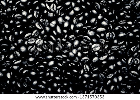 black and white background of coffee beans. view from above.