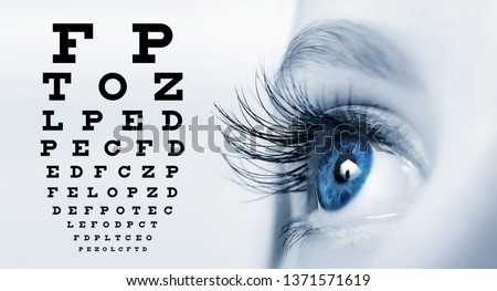 Close up of an eye and vision test chart Royalty-Free Stock Photo #1371571619