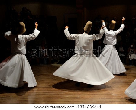 Whirling Dervishes show, sufi music, cappadocia, turkey Royalty-Free Stock Photo #1371636611