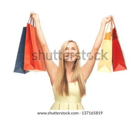 picture of happy woman with shopping bags .