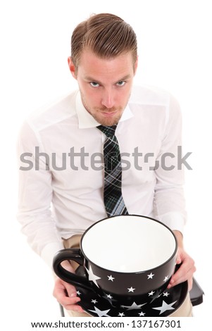 Businessman with a huge coffee cup. Wearing a white shirt and tie. White background.