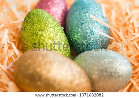 Beautiful Easter eggs decorated with sparkles. Close-up, soft focus, selected focus.