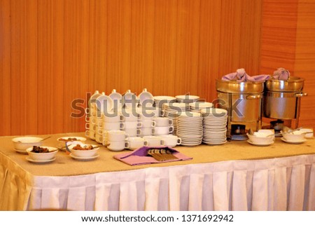 A picture of porride section with utensils in the hotel to be used by customers.