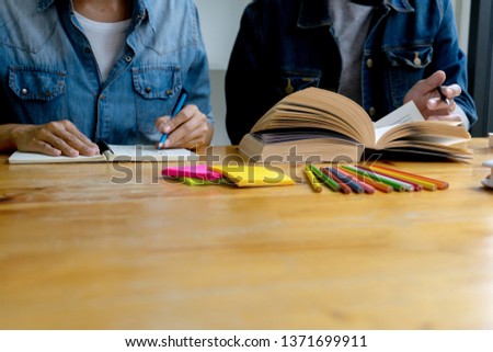woman and man work on the table with notebook laptop paper work  and color pen, in concept of education or business 