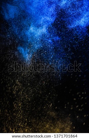   Multi-color powder explosion on black background