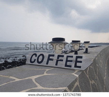a coffee sign on the shore