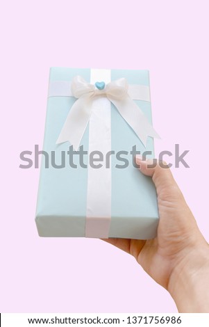 Blue Gift box for you on pink Background.