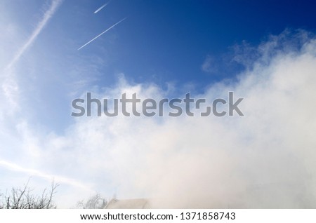 Smoke and blue sky