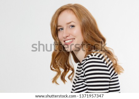 Happy woman close up face isolated on white background. Red hair girl with curly hair. Skin care and teeth care. Copy space