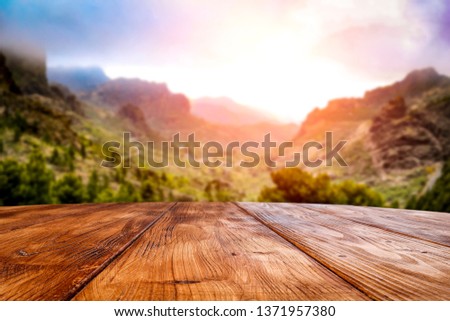 Desk of free space and summer landscape of mountains 