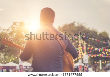 Musicians are playing guitar on stage. Royalty-Free Stock Photo #1371977555