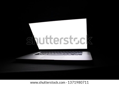 laptop on black background front view