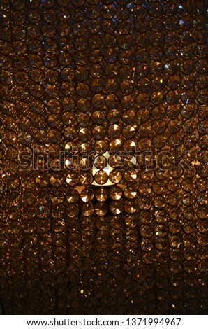 Handcrafted lamp cover with golden glow at the market
