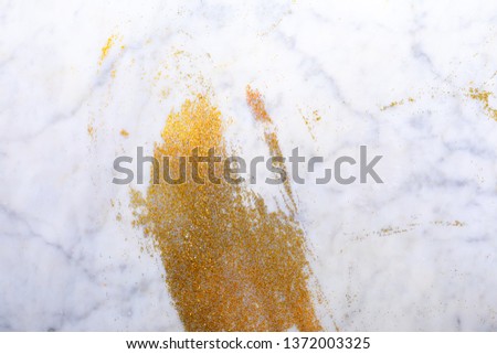 Smear of gold sequins 