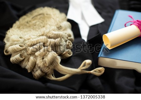 Legal Concept Still Life Of Barristers Wig With Gown And Brief Royalty-Free Stock Photo #1372005338