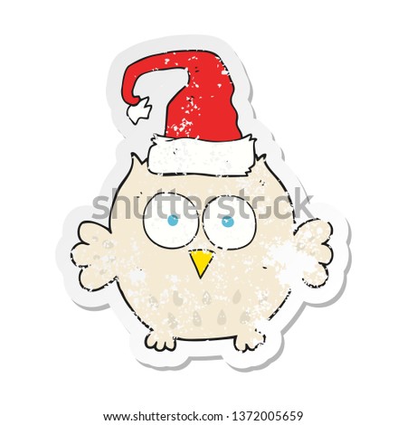 retro distressed sticker of a cartoon owl wearing christmas hat