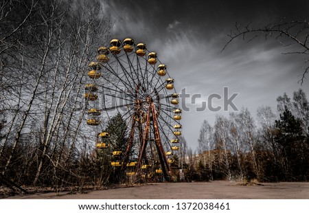 Old ferris wheel in the ghost town of Pripyat. Consequences of the accident at the Chernobil nuclear power plant Royalty-Free Stock Photo #1372038461