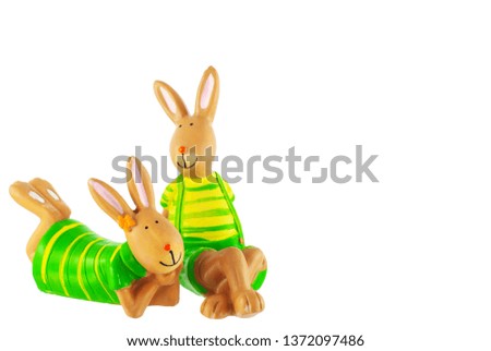 hares sitting and lying on a white background