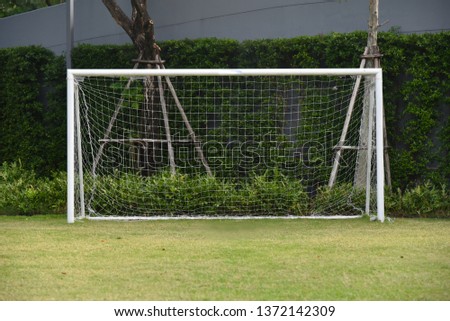 Sport concept : Soccer goal with grass lawning 