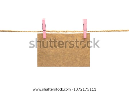 Kraft paper sheet for your text on the rope with a clothespin