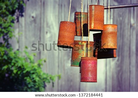 Scarecrow made of old rusted tin cans Royalty-Free Stock Photo #1372184441
