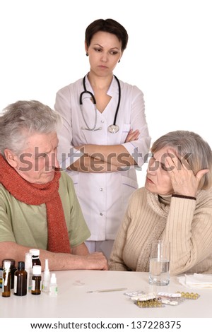 portrait of doctor and sick older caucasian couple over white background