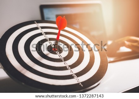 Set goals, bring experience to leadership and success, work goals, Red dart arrow on laptop background. Royalty-Free Stock Photo #1372287143