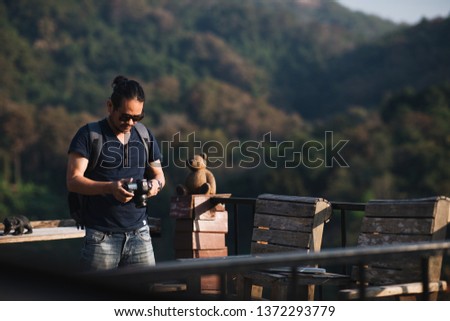 photographer taking photo of mountain, landscape
