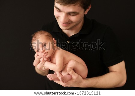 newborn baby in the hands of parents, closeup picture