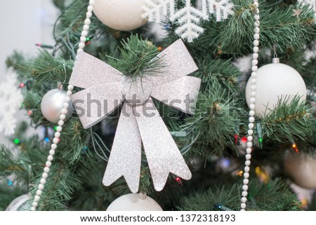 Christmas tree with beautiful lights and silver toys
