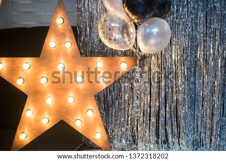 Foil balloons on the background against a shiny wall