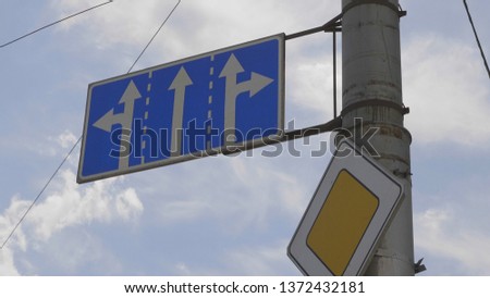 Road signs on a pole, the main road and the prohibition of truck traffic