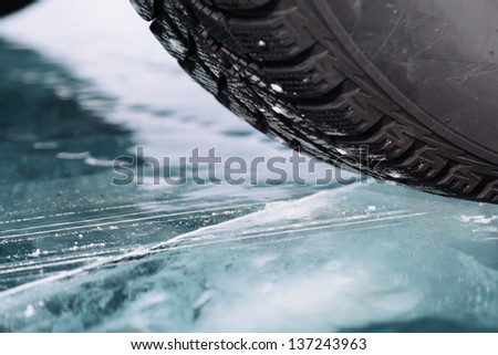 Winter tyres in extreme cold temperature Royalty-Free Stock Photo #137243963