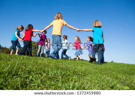 Group of Girls Holding Hands in a Circle Outside - Unity, Friendship Royalty-Free Stock Photo #1372459880