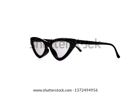 Black triangular cat eye sunglasses isolated on white background. Side view.