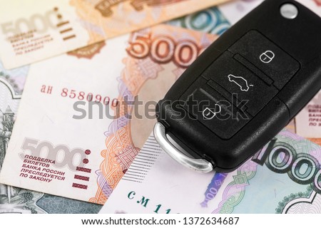 closeup car key on russian rubles banknotes