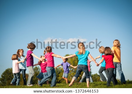 Group of Girls Holding Hands in a Circle Outside - Unity, Friendship Royalty-Free Stock Photo #1372646153