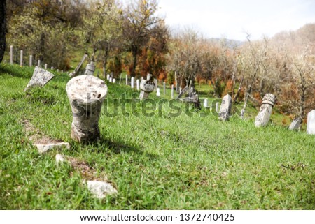 Old graves on a Muslim cemetery.-Image