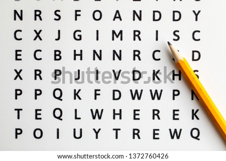 Word search with scrambled letters and hidden words Royalty-Free Stock Photo #1372760426